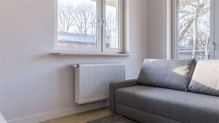 Is it OK to have radiator behind sofa?