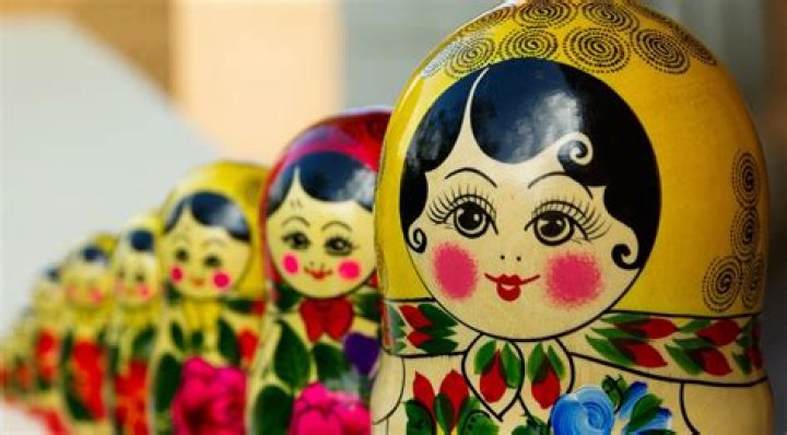 What do matryoshka dolls represent?