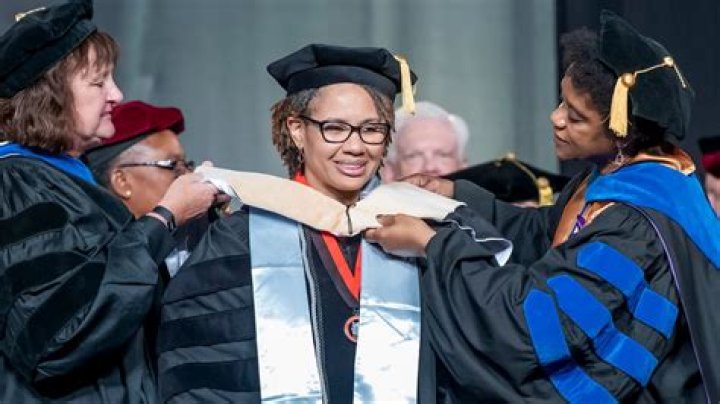 What is a PHD graduation called?