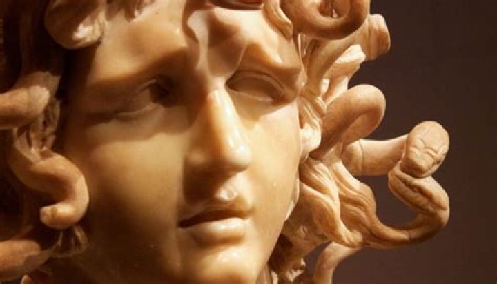 Why did Athena put a curse on Medusa?