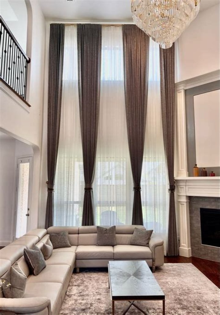 Why do people put floor to ceiling curtains?